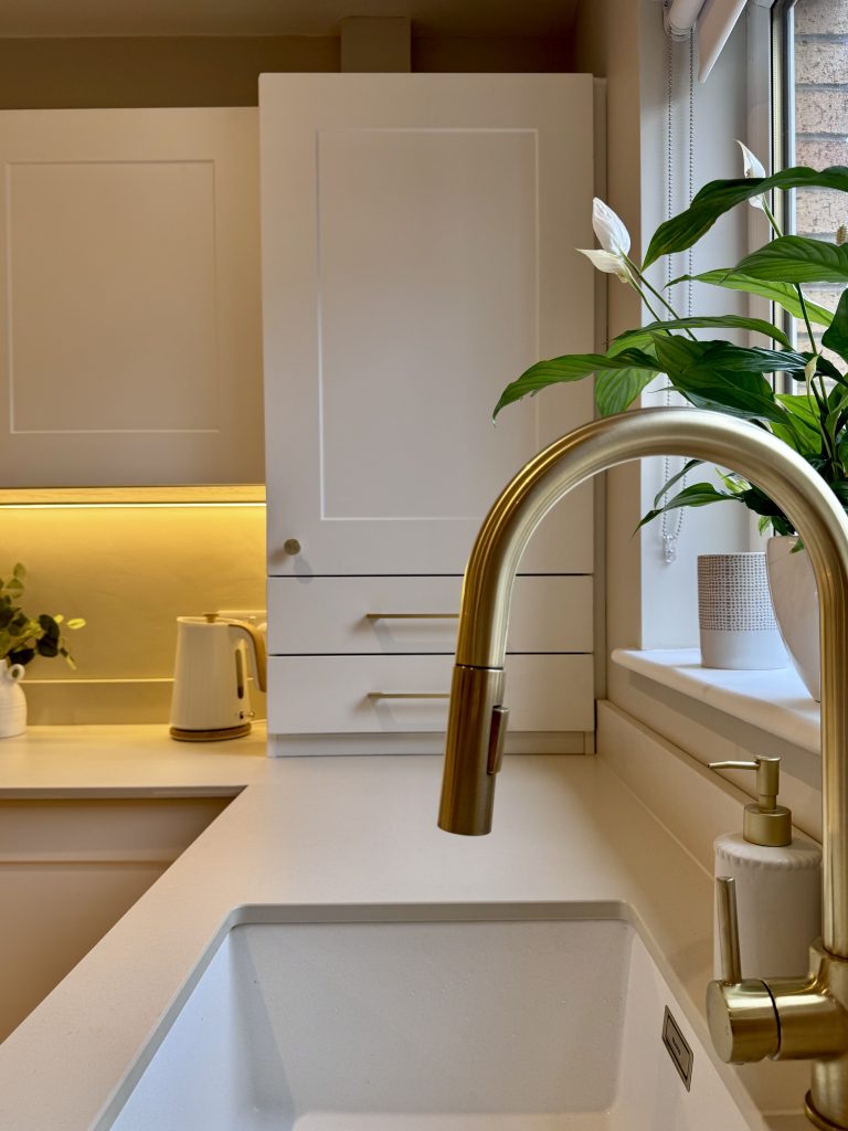 Gold kitchen faucet detail
